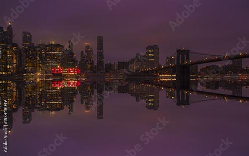 Beautiful view of New York City Manhattan skyline and Brooklyn Bridge on the moody morning