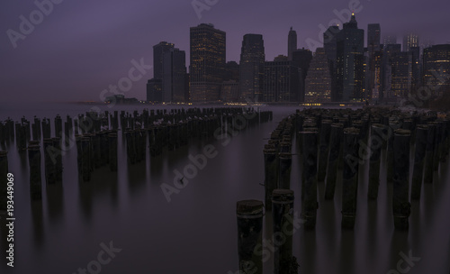 Foggy New York City Manhattan downtown skyline view during sunrise