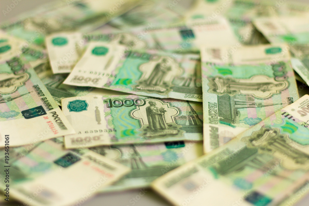 money, Russian banknotes in denominations of one thousand rubles scattered on the table money, Russian banknotes in denominations of one thousand rubles scattered on the table