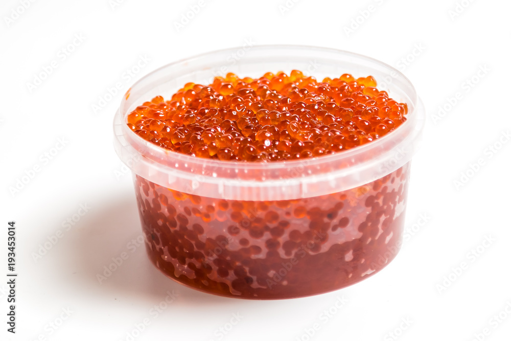 red caviar salmon in a jar on a white background