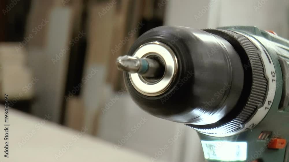 The video shows Cordless drill close-up. Screwdriver