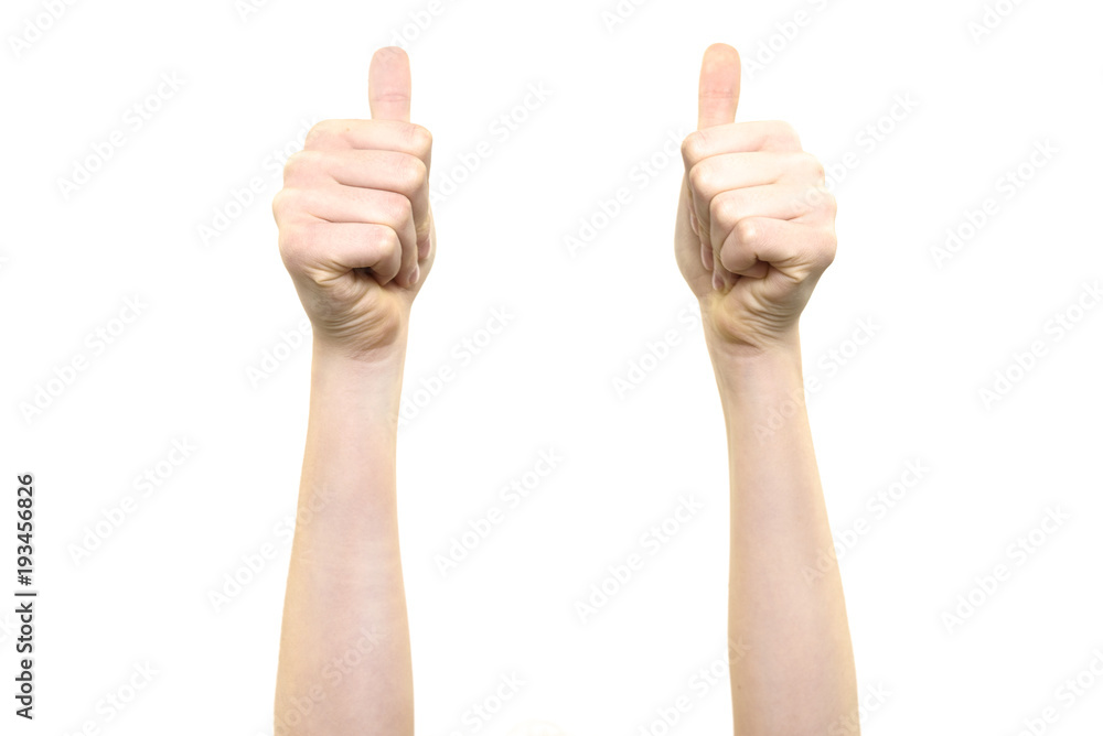 Woman is holding two thumbs up into the air on a white background