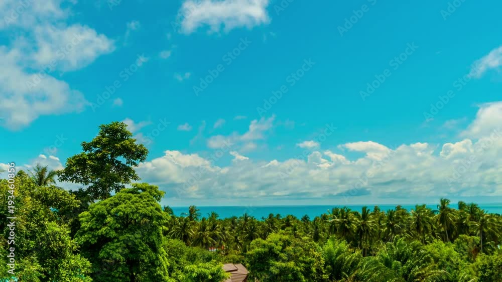 Fly clouds over sea and palm trees on a tropical island Koh Samui. 4k time-lapse
Fly clouds over sea and palm trees on a tropical island Koh Samui. 4k time-lapse