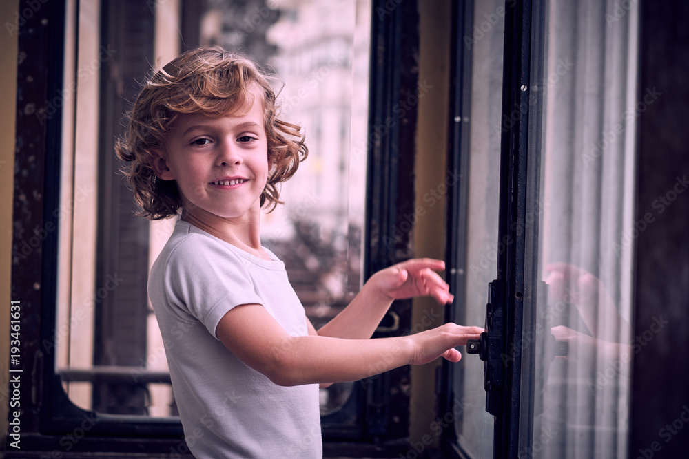 Little boy standing on balcony Little boy standing on balcony