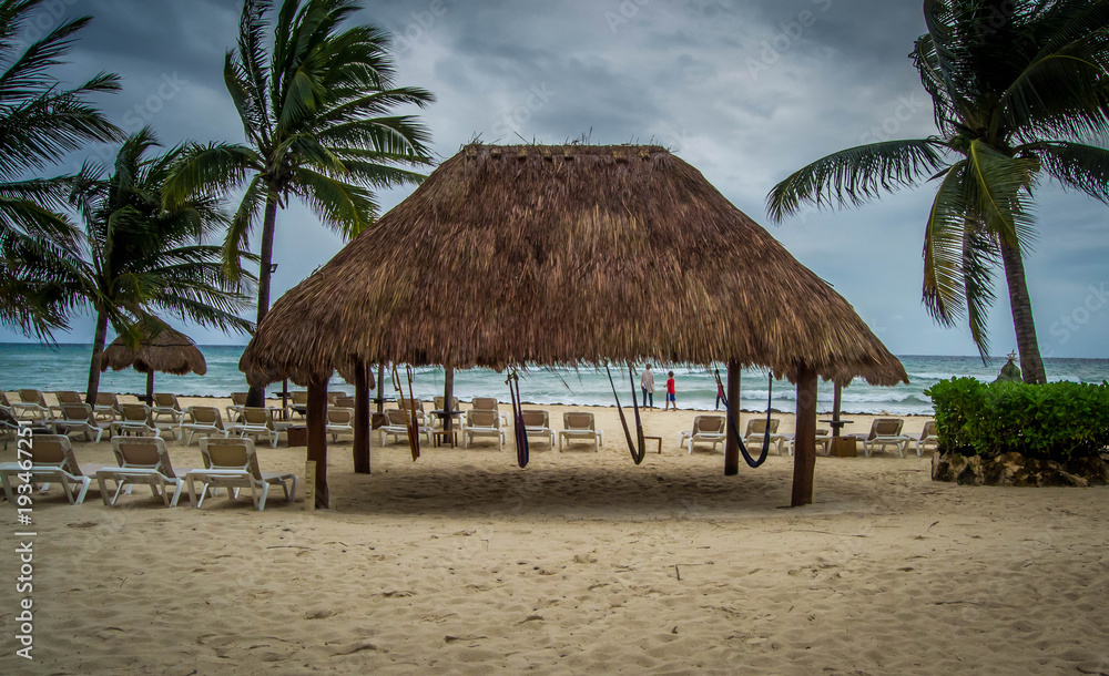 Fototapeta premium Four hanging hammocks at the beach