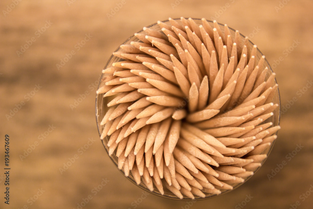 many toothpicks on the brown table background many toothpicks on the brown table background