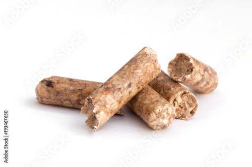 little pieces of pellet on white background