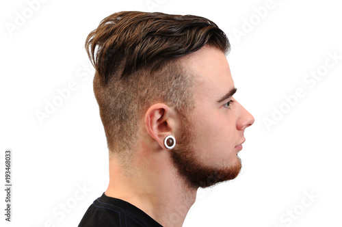 Collage of a handsome young man, with a beard and tunnels in his ears, isolated on white