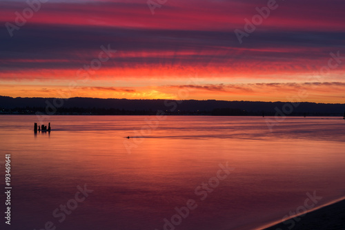 Colorful sunset over river © Nicholas Steven