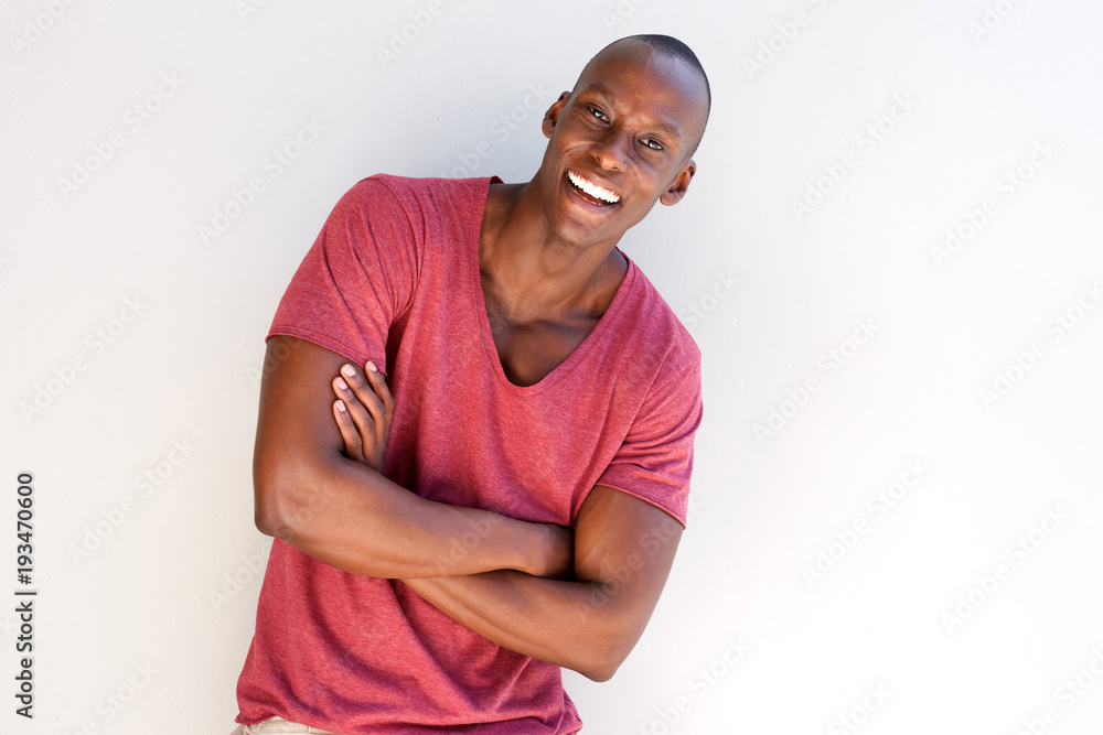 Obraz premium handsome african man smiling by white background