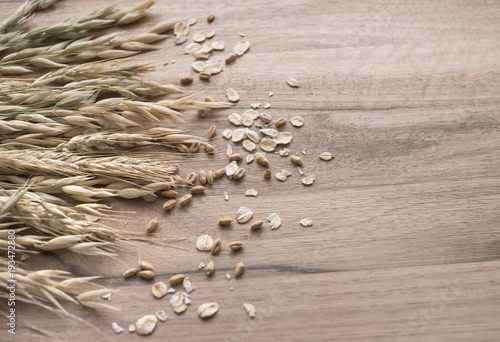 wheat and oat on wooden backround photo