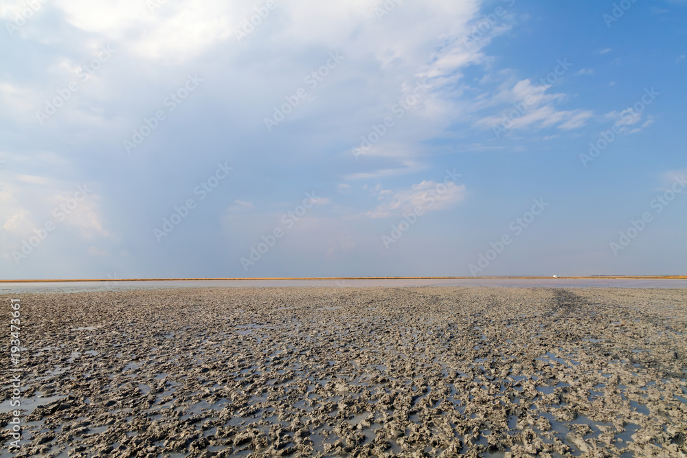 Fototapeta premium Clay in flat plain, steppe, salt, salt lake, heat and sky