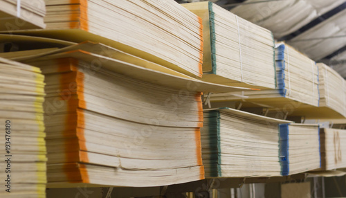 Plywood lies on the shelves of the warehouse