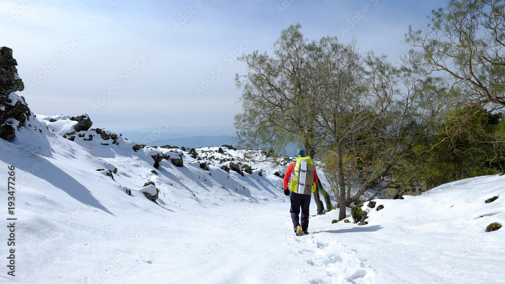 Hiker Walking On Snow In Etna Park, Sicily