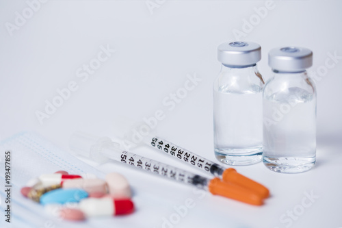 Two Insulin syringes with two ampules and some medicines