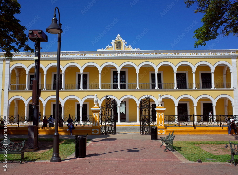 The main plaza of Campeche with the yellow Cultural Palace