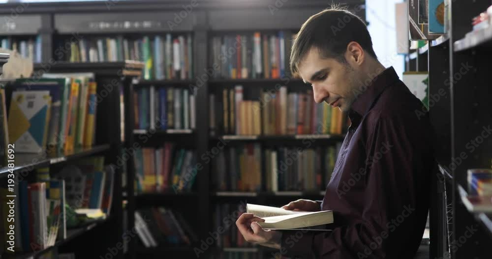 Student reading a book in the library. education concept Student reading a book in the library. education concept