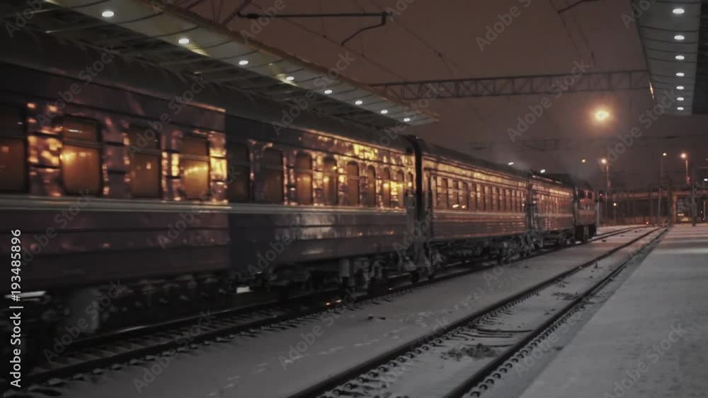 the train arrives at the station at night the train arrives at the station at night