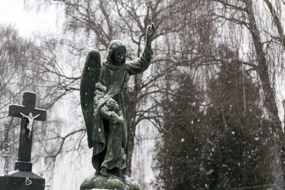 Naklejka premium Cemetery covered by snow in winter. Slovakia