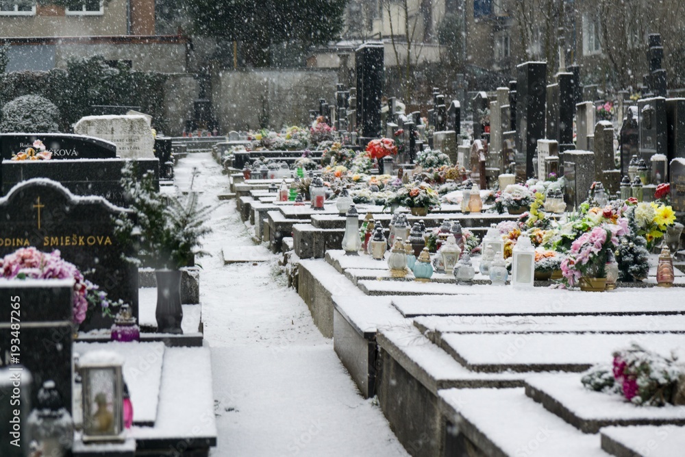 Obraz premium Cemetery covered by snow in winter. Slovakia