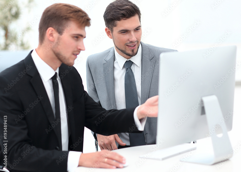 employees are talking sitting behind a Desk employees are talking sitting behind a Desk
