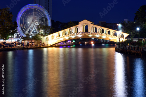 river view at night with walkway bridge in old town of Malacca, Malaysia