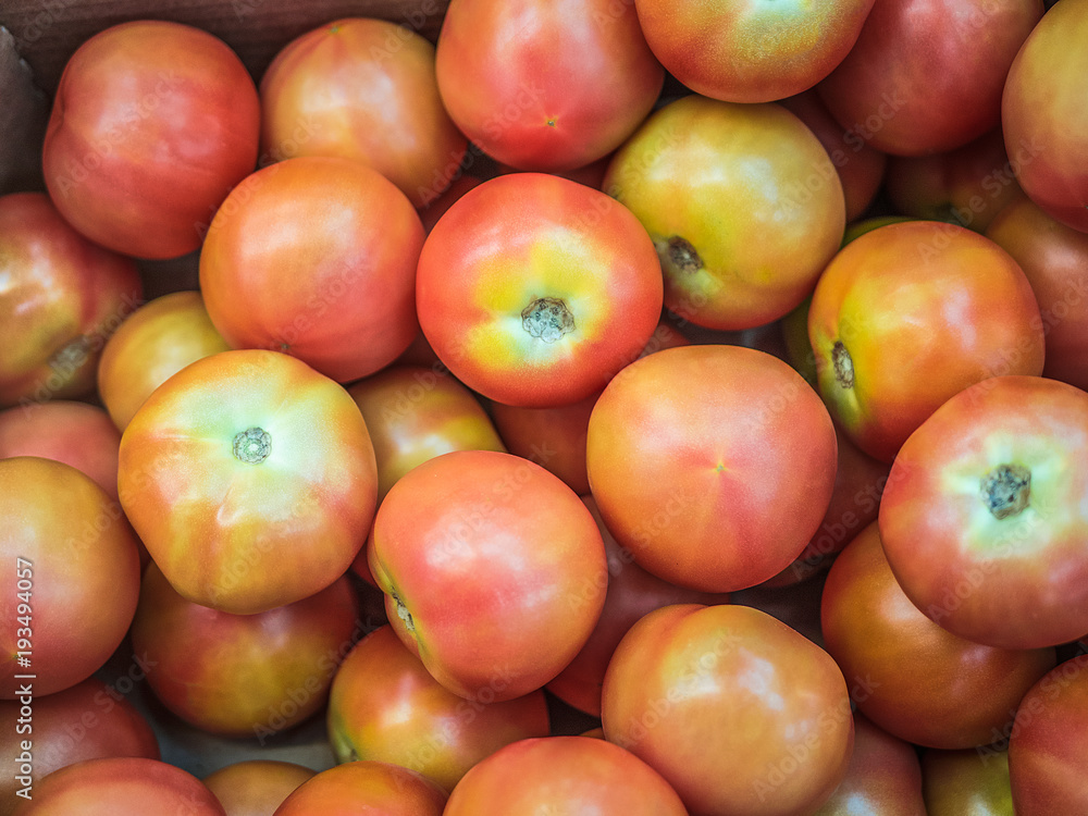 Many tomatoes on the store counter, vegetable themes Many tomatoes on the store counter, vegetable themes