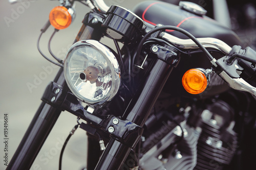 headlamp of a classic motorcycle, stylish front view, close-up