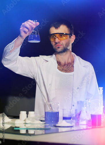 Scientist working at the laboratory. Laboratory assistant conducts medical research