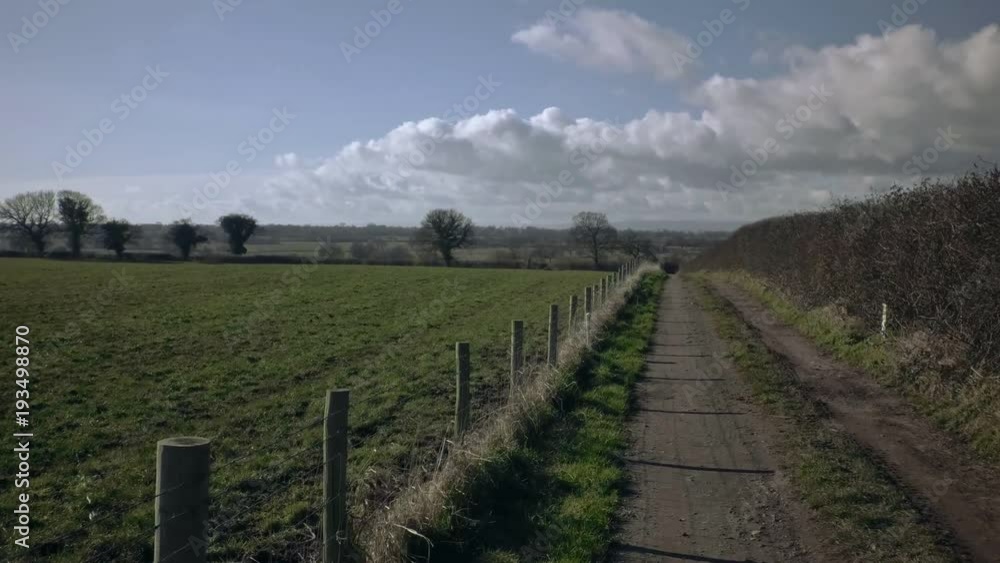 Part 1 of 4, Ride through empty countryside walking track. Wet ground with mud and puddles. Baker Path, Tarvin, Cheshire, England Part 1 of 4, Ride through empty countryside walking track. Wet ground with mud and puddles. Baker Path, Tarvin, Cheshire, England