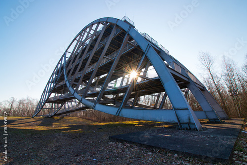 The sun shines through the steel structure of the Bitterfeld arch, a landmark of the East German chemical city. © Mattis Kaminer