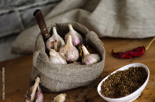 Raw garlic in the bag with spices- chilli pepper and coriander