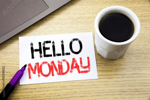 Handwriting Announcement text showing Hello Monday. Business concept for Day Week Start written on notebook book on the wooden background in the Office with laptop coffee