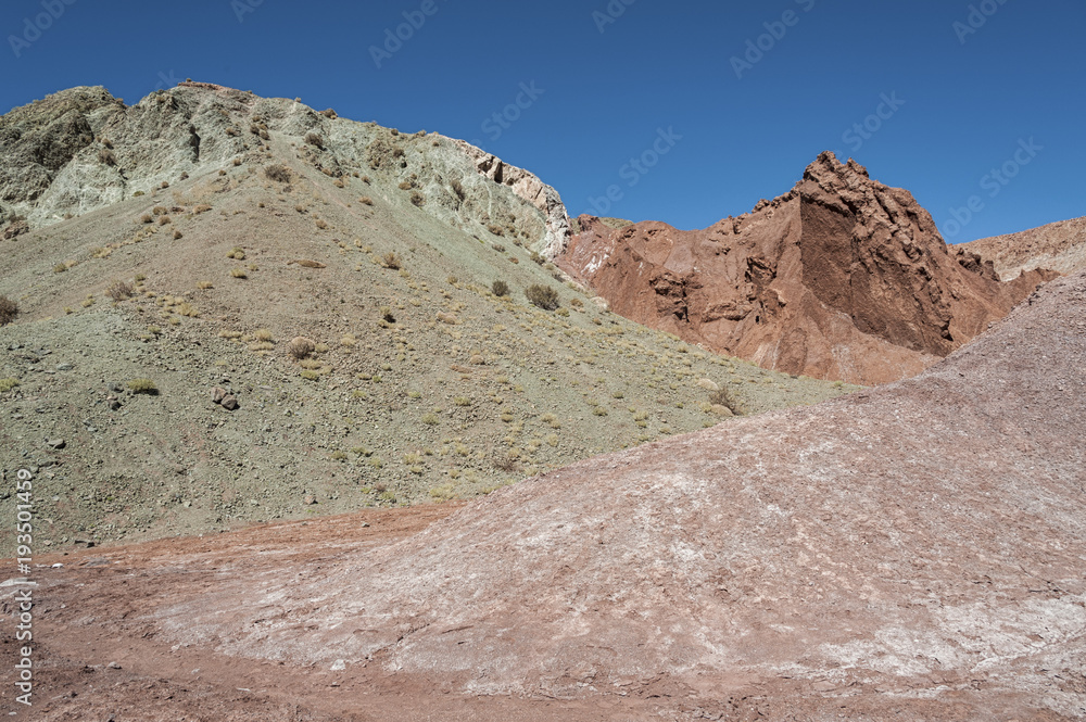 Rainbow Valley (Valle Arcoiris), in the Atacama Desert in Chile. The mineral rich rocks of the Domeyko mountains give the valley the varied colors from red to green.
