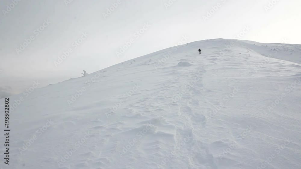 Man climber ascenting snow mountain hill ridge footstep road way path Man climber ascenting snow mountain hill ridge footstep road way path