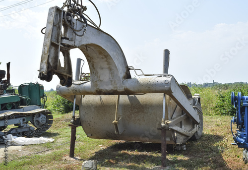 Grader on a trailer for heavy equipment. Trailer Hitch for tractors and combines. Trailers for agricultural machinery.