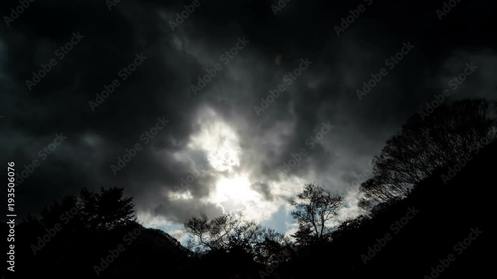 A black rain cloud is passing over the mountain. A black rain cloud is passing over the mountain.