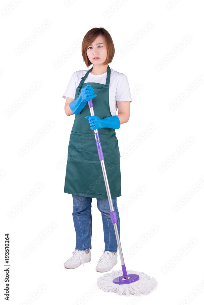 Young Asian housewife holding mop stand on white background Young Asian housewife holding mop stand on white background