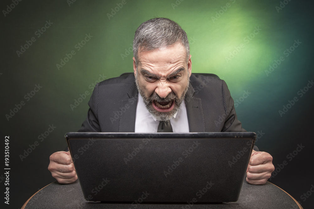 Stupid technology, angry senior corporate man Stupid technology, angry senior corporate man
