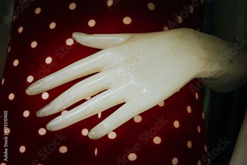 Closeup of Mannequin Hand with Dot Background