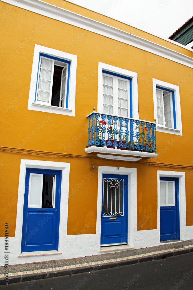 Bright House Architecture Mustard Color with Blue Doors in the Azores