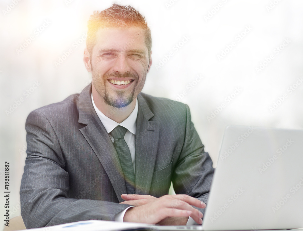 closeup.smiling businessman working with laptop closeup.smiling businessman working with laptop
