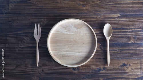 Wooden tableware on wooden background