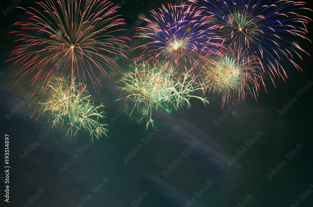 Fototapeta premium Fireworks celebration and the night sky background.