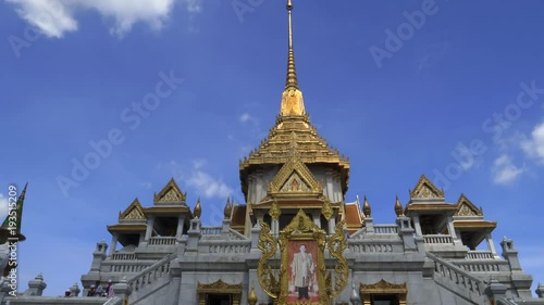 a front exterior view of wat traimit temple in bangkok, thailand photo