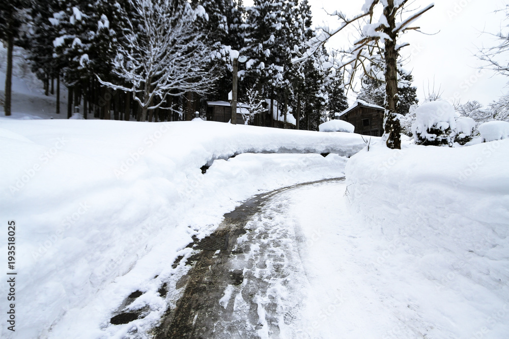 car tire track on snow in the winter road