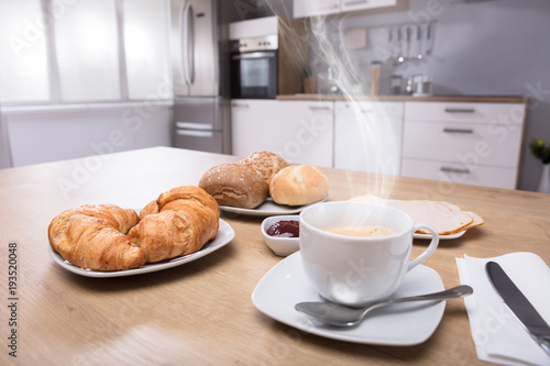 Fototapeta Naklejka Na Ścianę i Meble -  Close-up Of Croissants And Cup Of Coffee