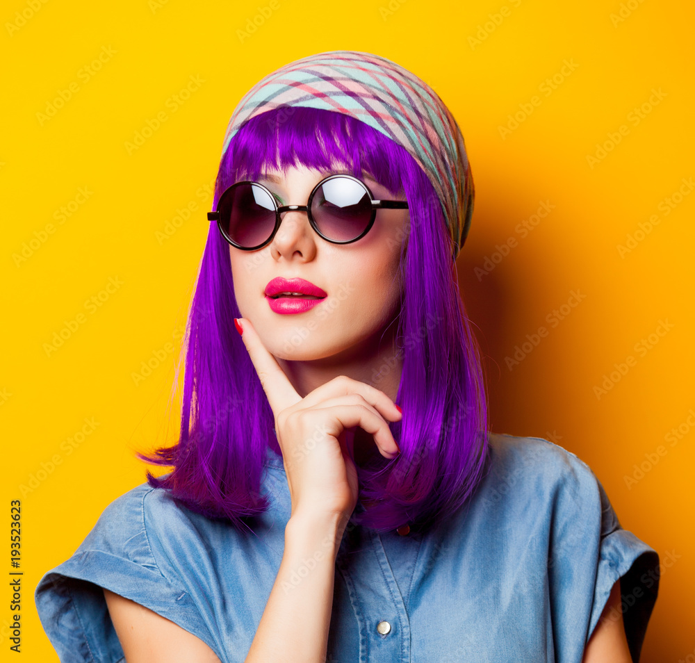 Young girl with purple hair and sunglasses