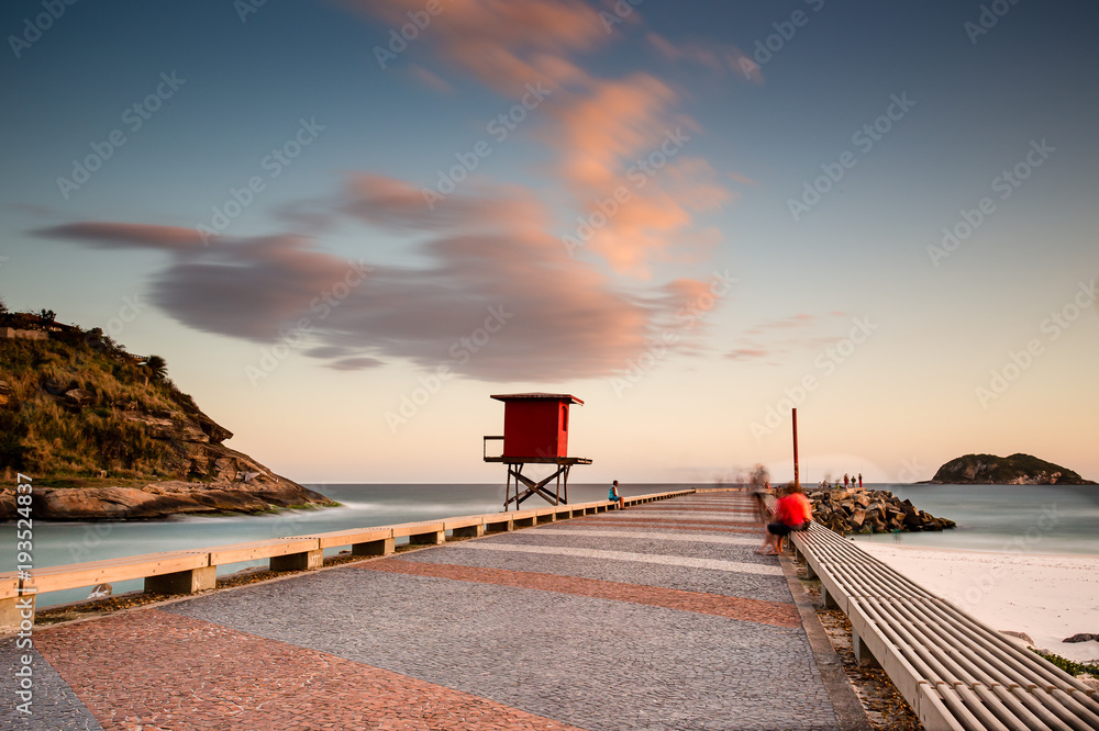 Naklejka premium Barra da Tijuca jetty beach on a beatiful afternoon. Long exposure