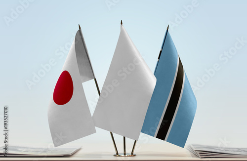 Flags of Japan and Botswana with a white flag in the middle